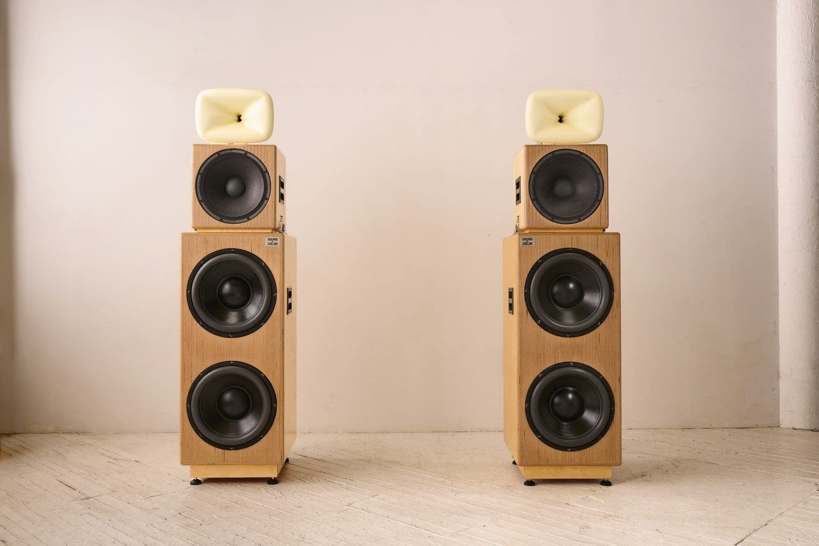 A pair of Sound + Color Sunshine speaker stacks in birch plywood