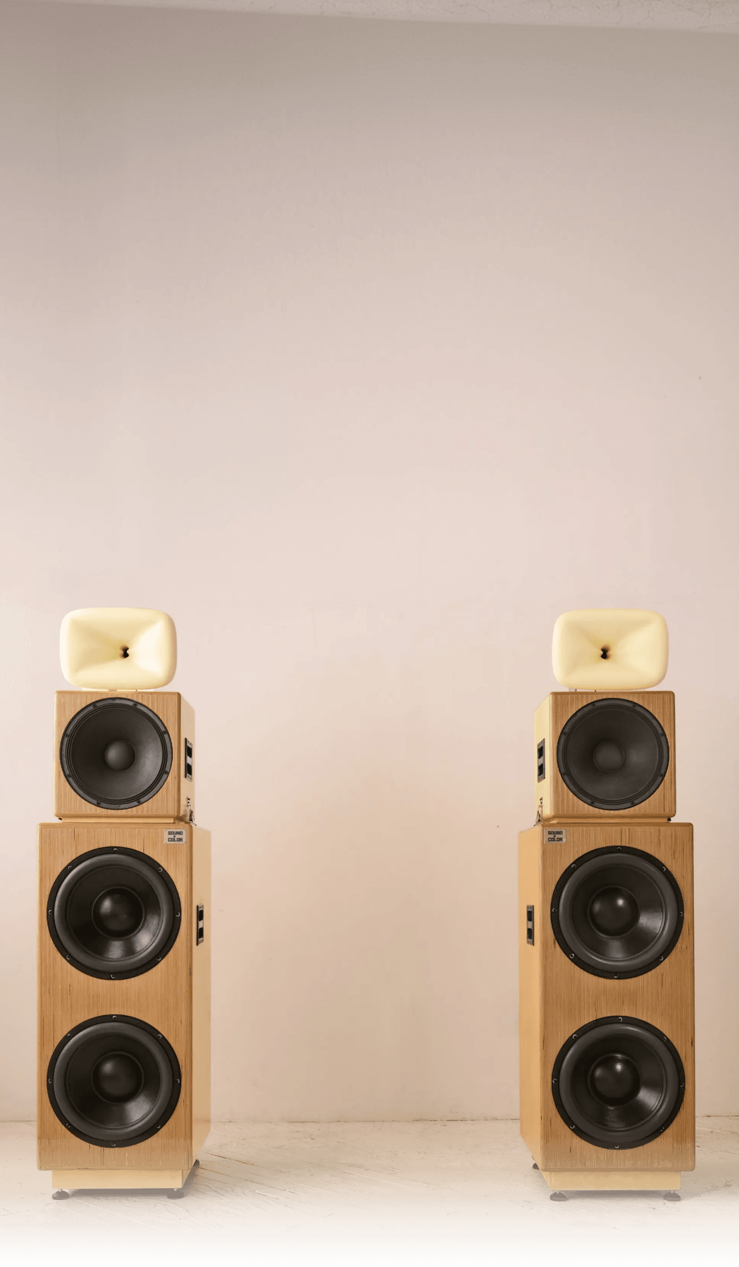 A pair of Sound + Color Sunshine speaker stacks in birch plywood